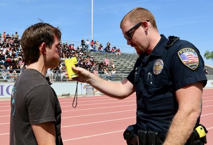 Lemoore High School and Every 15 Minutes, a lesson that keeps on teaching A suspect, gets a breathalyzer test from a Lemoore Police Officer.